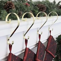 Haute Decor Stocking Scroll® Brass Stocking Holders, 4ct. 7 Haute Decor Stocking Scroll® Brass Stocking Holders, 4ct. -Christmas Designers Store D349640S 2