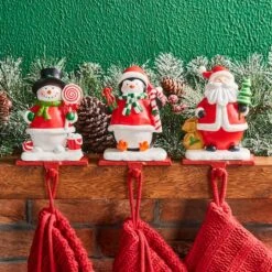 Glitzhome® 7" Santa, Snowman & Penguin Stocking Holder Set 13 Glitzhome® 7" Santa, Snowman & Penguin Stocking Holder Set -Christmas Designers Store D479500S 2